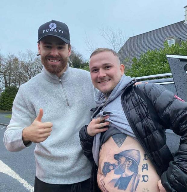 Lancashire Telegraph: Ben Brerton poses with Lewis Hamill after the 26-year-old had the footballer's face tattooed on his belly 