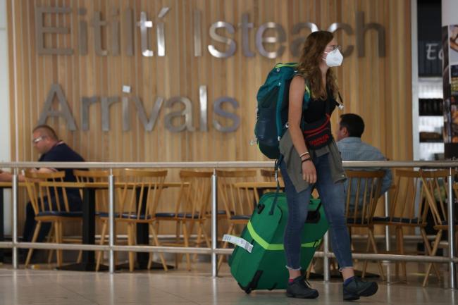 Passenger wearing a mask arrives at Terminal 1 in Dublin Airport in the Republic of Ireland. Photo: PA.