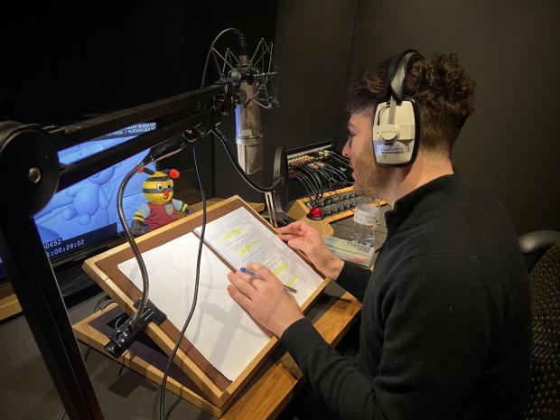 Lancashire Telegraph: BBC Radio 1 DJ Jordan North recording the voiceover for the animation with the help of Bertie Bee