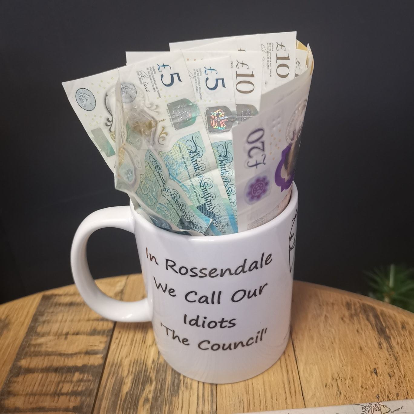 One of the mugs filled with the cash they have raised for Rossendale Hospice