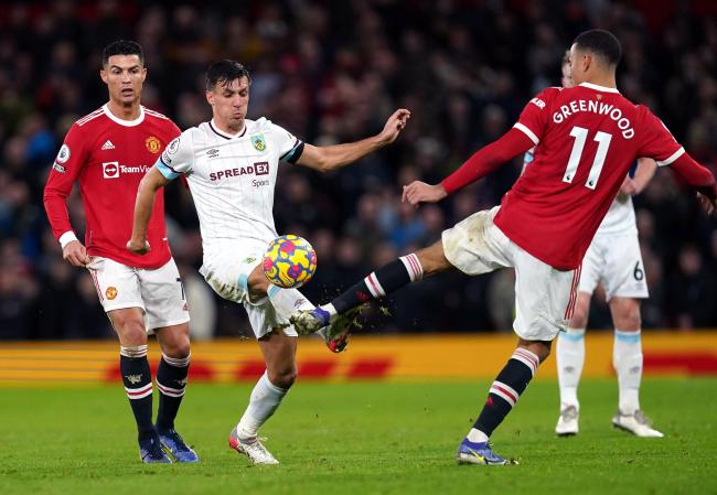 MAN IN THE MIDDLE: Jack Cork in the thick of the action at Old Trafford