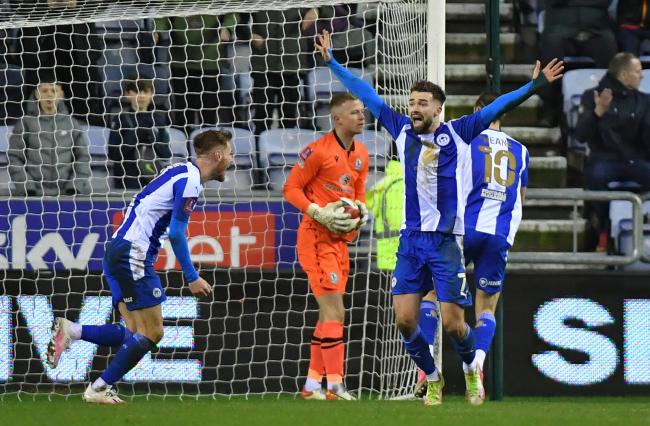 Wigan celebrate their second goal in the FA Cup win over Rovers