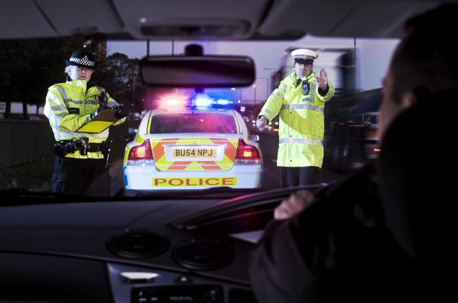 A driver being pulled over by police. Photo credit: West Midlands Police