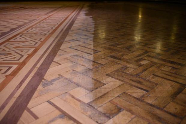 Lancashire Telegraph: An example of the original and partially restored sections of the floor of the historic Blackpool Tower Ballroom as wood sanding technicians work to restore it to its former glory (Oli Scarff/Blackpool Tower/PA)