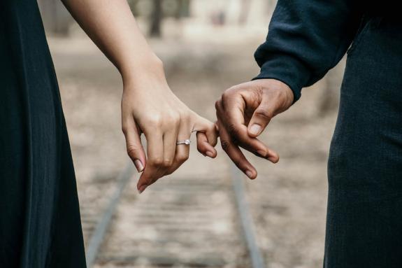 Lancashire Telegraph: A couple linking fingers while she wears an engagement ring. Credit: Canva Lancashire Telegraph: A couple linking fingers while she wears an engagement ring. Credit: Canva
