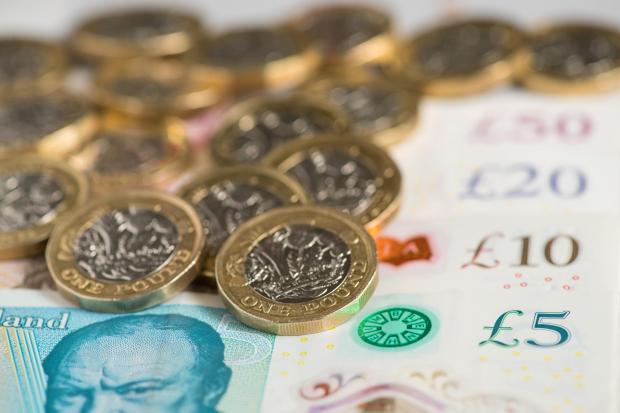 Lancashire Telegraph: Real pay is set to be £470 per worker lower each year on average (PA)