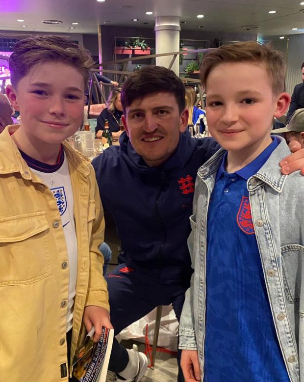 Lancashire Telegraph: Freddie (left) and Hughie (right) with Harry Maguire