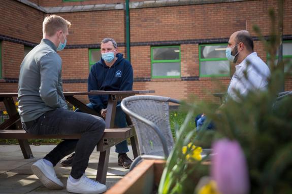 Lancashire Telegraph: Ben Mee speaks with NHS staff Neal Ashurst and Ilyas Adam Lancashire Telegraph: Ben Mee speaks with NHS staff Neal Ashurst and Ilyas Adam