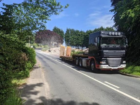 Lancashire Telegraph: A lorry driving away from the Punch Bowl Inn in Hurst Green Lancashire Telegraph: A lorry driving away from the Punch Bowl Inn in Hurst Green