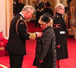 Lancashire Telegraph: Sylvia being given her OBE by Prince Charles at Buckingham Palace