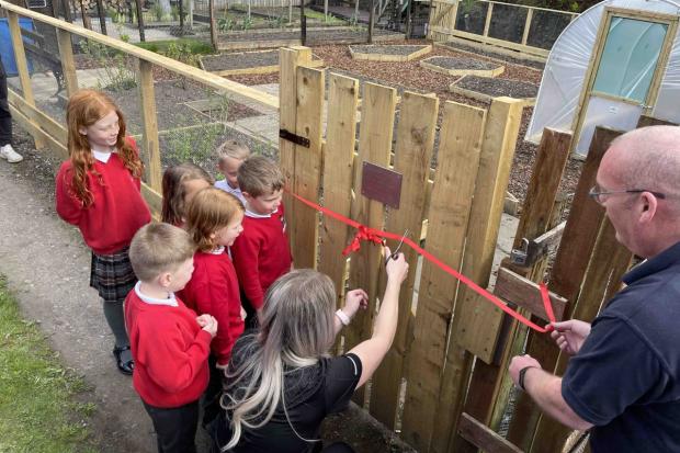 Pupils opening the allotment space at Gisburn Road Primary School