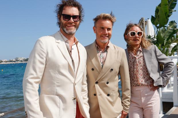 Take That's Howard Donald, Gary Barlow and Mark Owen at the 75th Cannes Film Festival