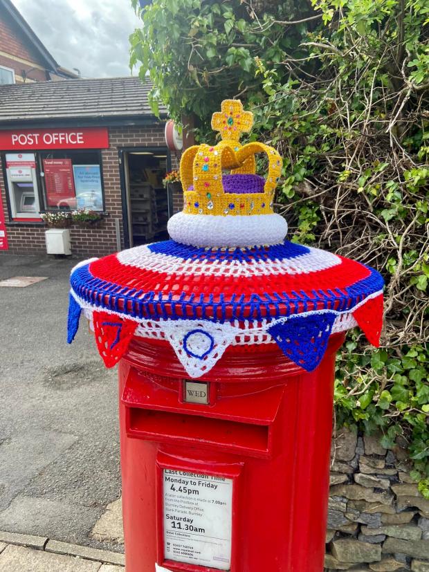 Lancashire Telegraph: A post box has been topped with a crocheted crown to celebrate the Queen's Platinum Jubilee(Photo: Frank Lumsden)