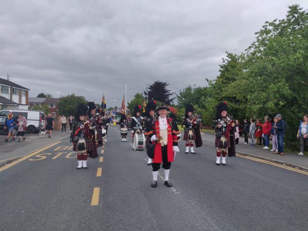 Lancashire Telegraph: The Hyndburn crier, Rawden Kerr opened the parade and was followed by the Accrington Pipe Band