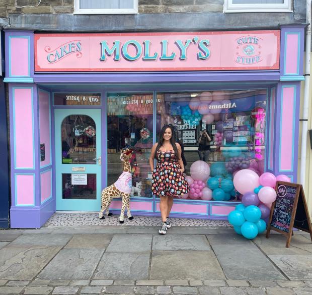 Lancashire Telegraph: Molly Robbins outside her new cake shop in Rawtenstall