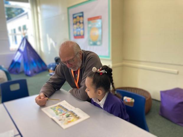 Lancashire Telegraph: Reading volunteer and primary school pupil Luna