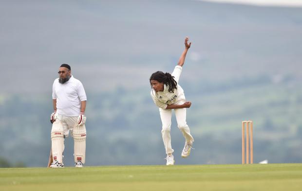 Lancashire Telegraph: Jeremy Davies from Thornton in action bowling during the interfaith cricket match played at Stonyhurst College