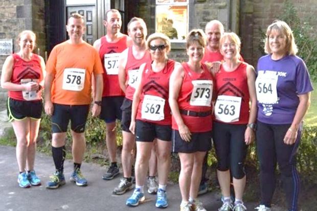 GROUP: Horwich Harriers with marathon queen Julie Williamson, second right. Picture by Andrew Storey