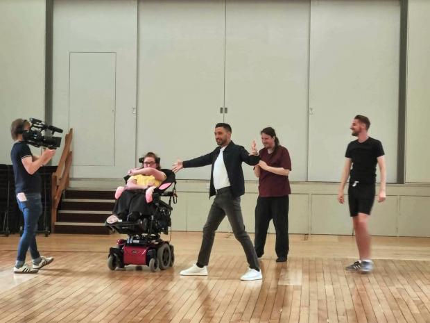 Lancashire Telegraph: Giovanni Pernice teaching DanceSyndrome members some dance moves