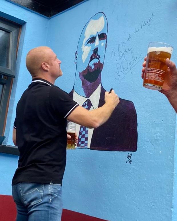 Lancashire Telegraph: Sean Dyche signed the portrait of him in the beer garden