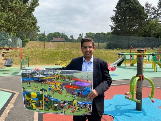 Lancashire Telegraph: Council Leader, Councillor Nadeem Ahmed at Marsden Park, with one of the plans