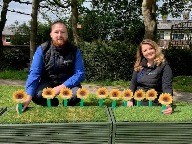 Lancashire Telegraph: Husband and wife Carl and Charlotte Knowles take part in the Corporate Challenge to raise funds for East Lancashire Hospice 