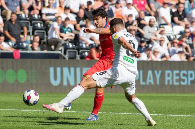Lewis Travis fired home Rovers' third goal against Swansea City
