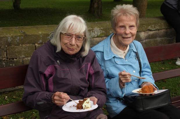 Lancashire Telegraph: Rosemary Ratcliffe and Jean Mather enjoy a cake and reminisce about the park party.