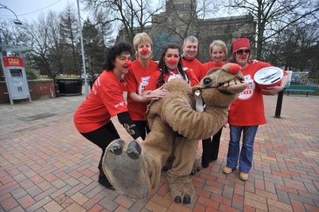 Staff from BT exchange, Jubilee Street in Blackburn raise money with Humphrey the camel. Racing the camel is Janice Eccles with her, l-r,  Angela Taylor, Elaine Worden, Colin Siequien, Barbara Davies, Sandra Wright.