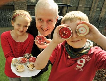 QEGS pupils with marketing officer, Phil Lloyd show off Comic Relief Cakes.