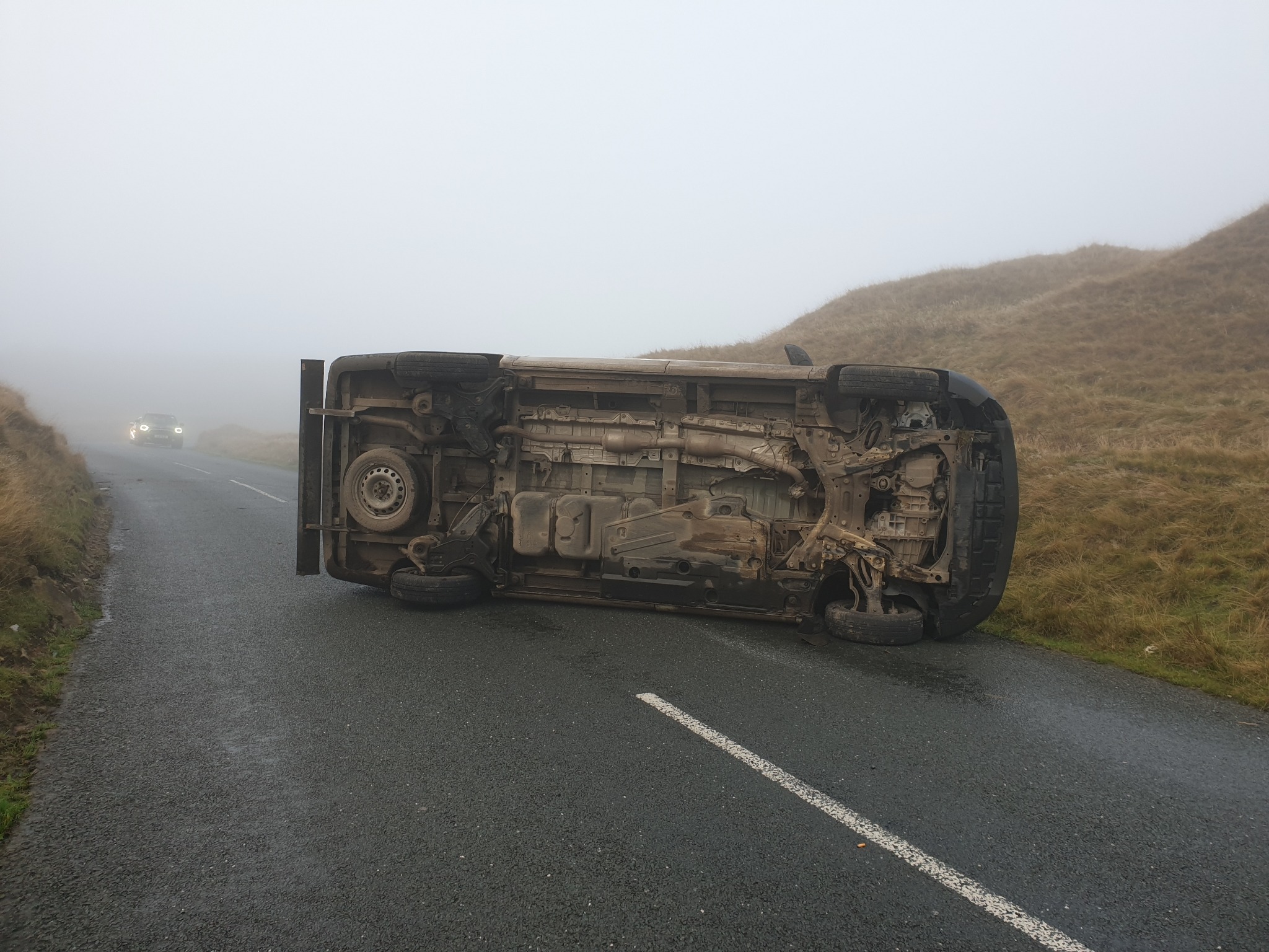 Car flips and crashes on its side on Clitheroe Road