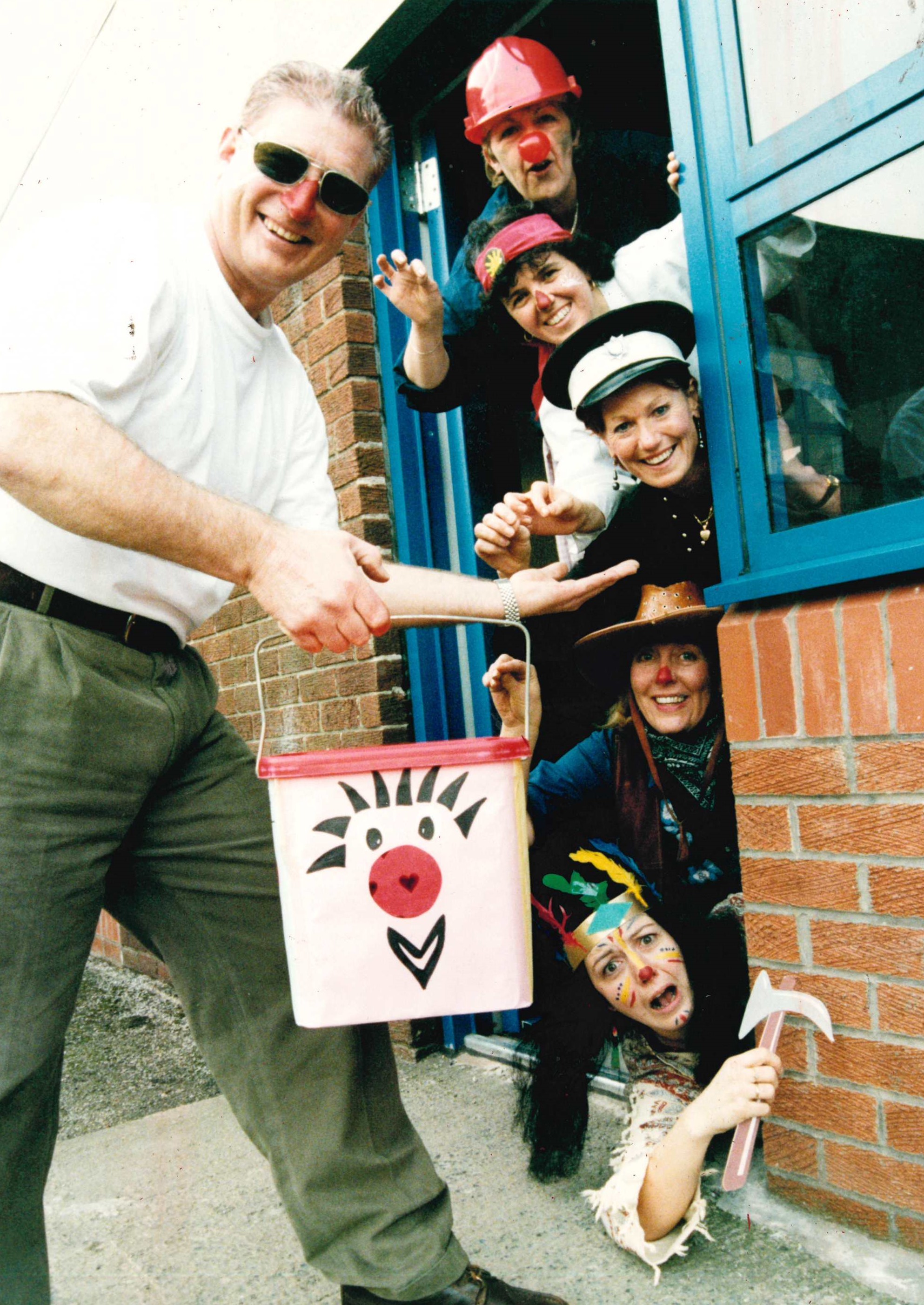 Ian Maddison (left) deputy head at Crosshill School, charges staff in fancy dress to leave the building for Red Nose Day, 1999. (From top) Dette Hodkinson, Angela Snape, Angie Laverick, Pauline Lyons and Anne Thornton