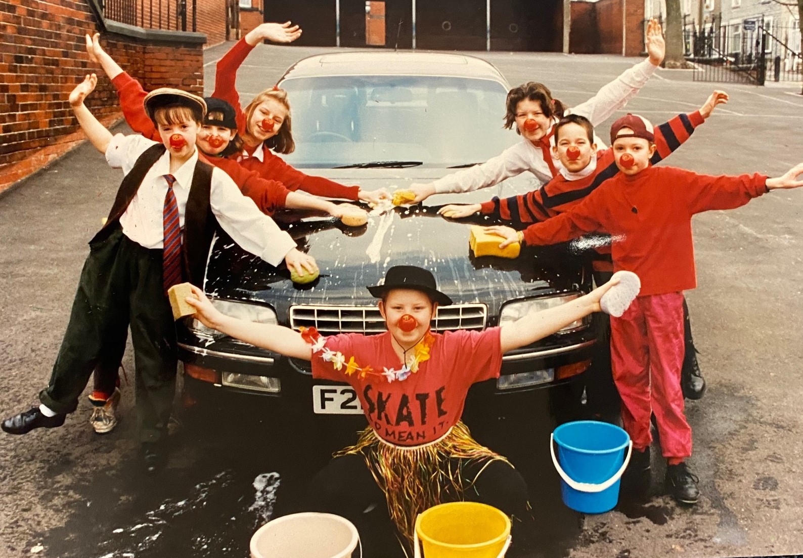 Comic Relief car wash at Heasandford Junior School, Burnley, in 1993. Louise Windle, centre, with Gemma Lee, Stacy Helm, Deborah Halstead, Leanne McNulty, Chris Johnson and Rebecca Brindle