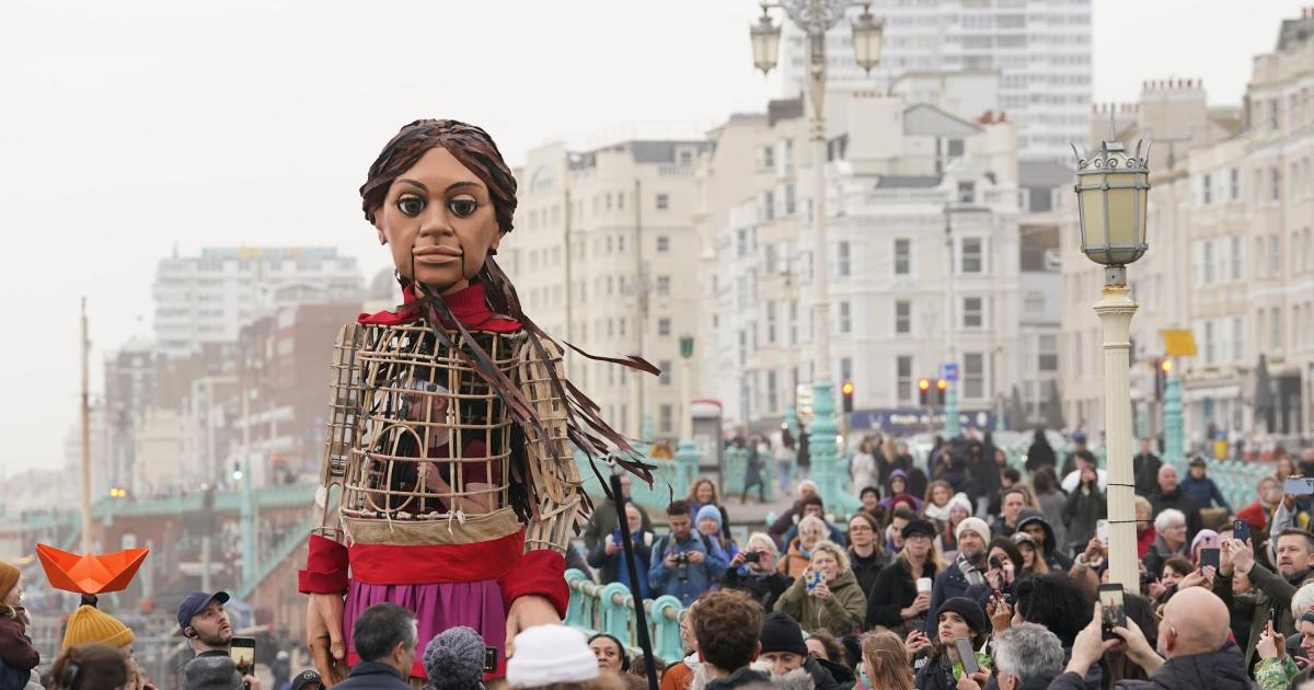 Giant puppet Little Amal leads walk in Brighton to raise awareness of refugees - Vimarsana News