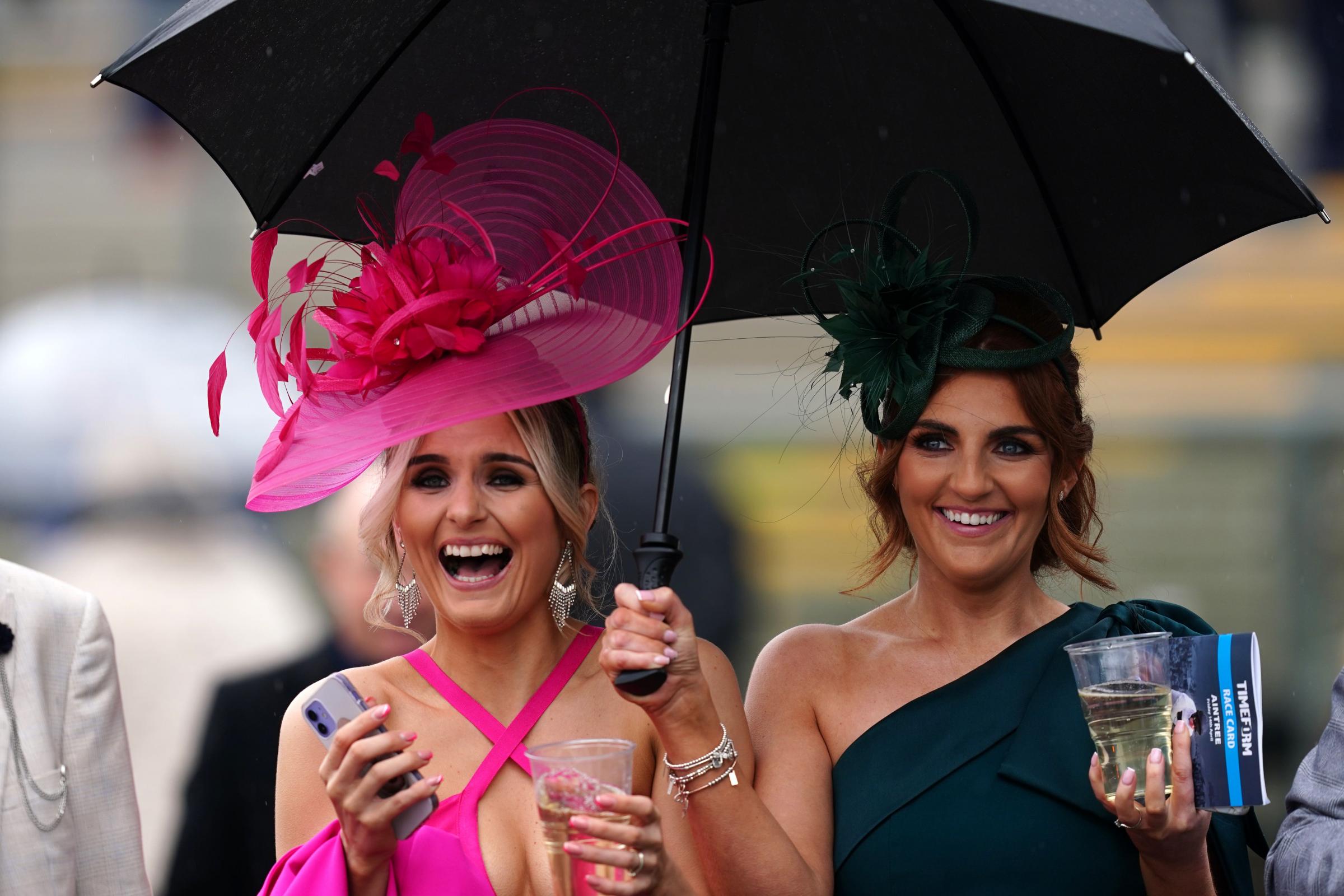 Racegoers brave downpours for Aintree's Ladies Day | Lancashire Telegraph - Vimarsana News