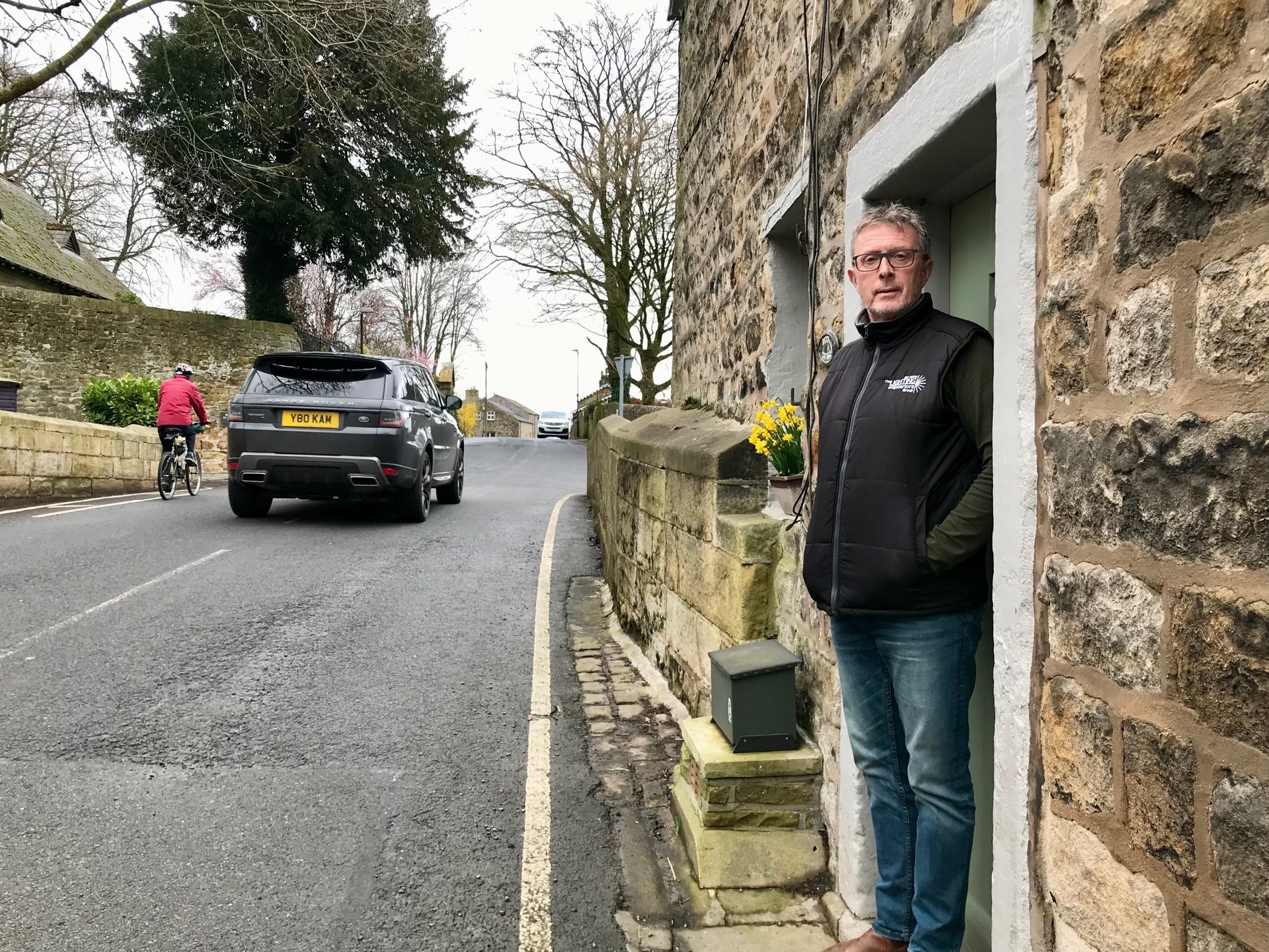 Steve Nightingale at his house in the Square, Waddington near Clitheroe. The old bridge takes traffic to and from West Bradford. Haweswater tunnel planning application by United Utilities.
