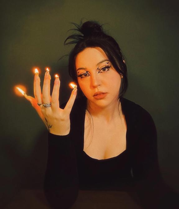 Lancashire Telegraph: Natasha Jane Wood with special effects candle fingers Lancashire Telegraph: Natasha Jane Wood with special effects candle fingers