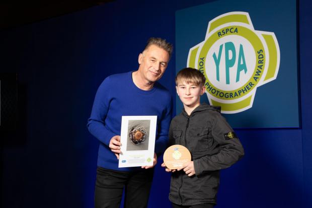 Corbyn being given his award by Chris Packham at the ceremony