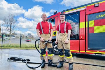 Fire crews in Blackburn raise £526 at charity car wash