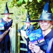 OUR WAY: ‘Witches’ (from the left) Sue Unwin, Dorothy Dowling and Geraldine Cocker read the new brochure on the Pendle Witches Trail