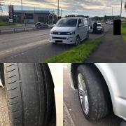 The driver was not only caught with bold tyres but was also caught on his mobile phone