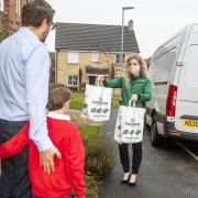 Morrisons staff delivering the supermarkets new school meal packs (credit: PA Wire)