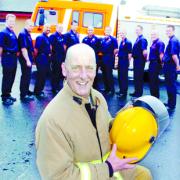 ENDING ON A HIGH: Colin Western’s colleagues line up to honour him after he rescued a woman from a house in Petre Crescent, Rishton