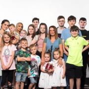 The Radfords, from Morecombe, have 22 children and 11 grandchildren, with another on the way (PA)