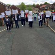 Protest: Altham West residents have taken to the streets to oppose masts being built
