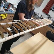 The glider wing being constructed in the groups kitchen