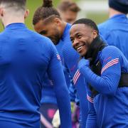 Raheem Sterling enjoys a laugh on the England training ground