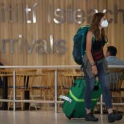 Passenger wearing a mask arrives at Terminal 1 in Dublin Airport in the Republic of Ireland. Photo: PA.
