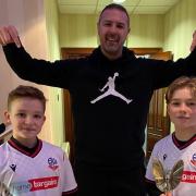 Hughie Higginson (left) and Freddie Xavi (right) were joined by Paddy McGuinness on their Bolton charity football run.