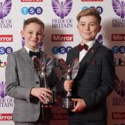 Hughie Higginson and Freddie Xavi with their Pride of Britain trophies